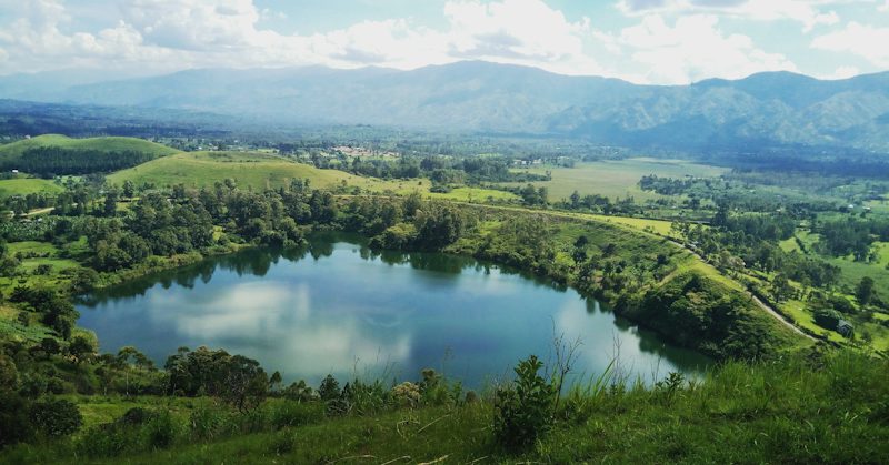 Volcanic crater lakes and rolling hills of the Kasenda field near Fort Portal